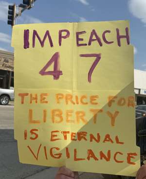 Protest sign reading "Impeach 47 The price for liberty is eternal vigilance"